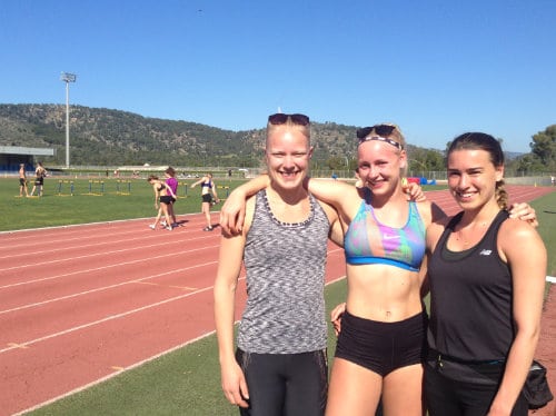 Athletes posing on the running track