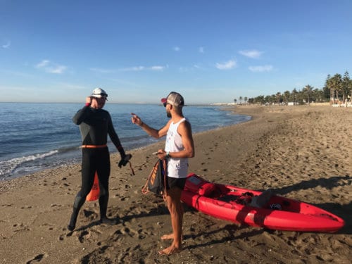 Open water swimmers on the beach in Marbella